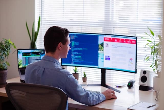Man working looking at his screen_Marketing tools